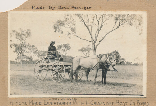 A Homemade Buckboard Cart With a Galvanised Boat on Board