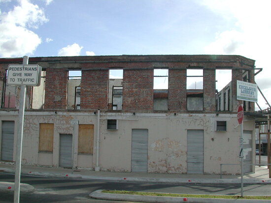 Series of photos of interior of fire damaged Excelsior Hotel before restoration