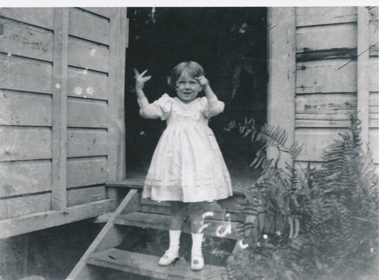 Edna Meredith Wooster on back stairs of Mary Street House