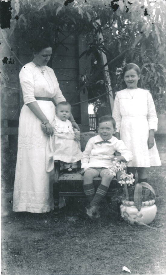 Harriet Wooster with children Edna, Horace and Norma in Backyard