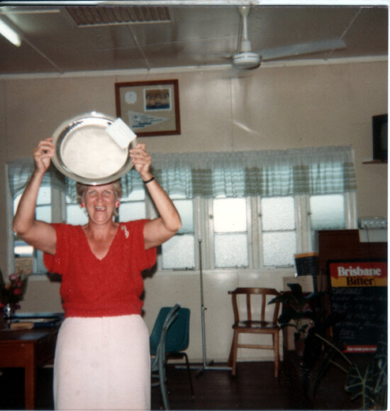Pam Sellars holding up silver plate