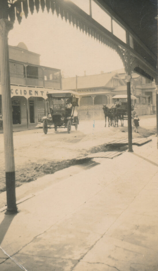 Motor Car Outside Ben Toll&rsquo;s Building, Gill Street With Horse Drawn Vehicle in Background