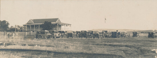 Golf Clubhouse with Motor Vehicles Outside