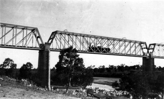 Large Picnic Party at the Burdekin River Showing Rail Bridge With Steam Train on Track