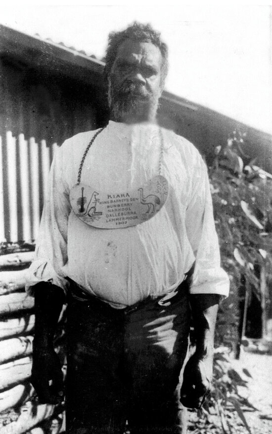 King Kiara Wearing a Brass Chest Plate