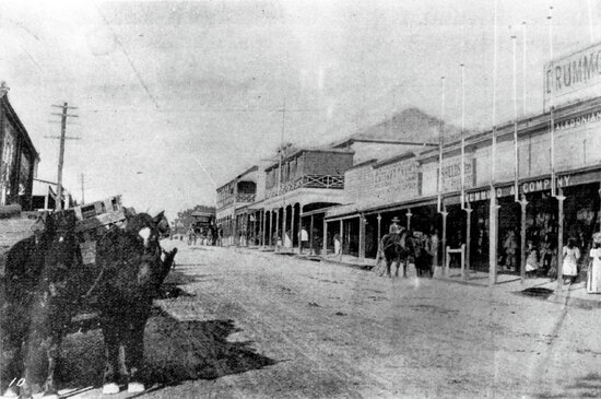 View on Gill Street looking towards Church Street intersection, Drummond &amp; Co in foreground with Excelsior Hotel in centre of photo