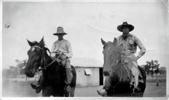 Larry Dalhunty and his father riding horses