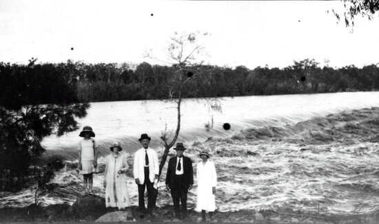 Burdekin River in Flood with Group of People on bank of the Weir