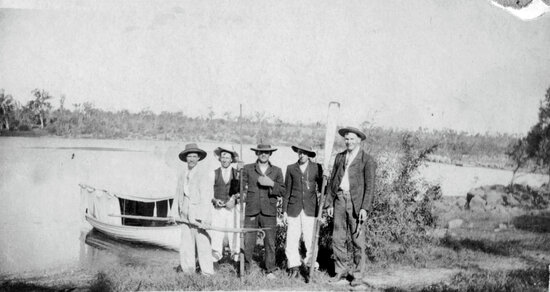 Five men at the Weir with boat