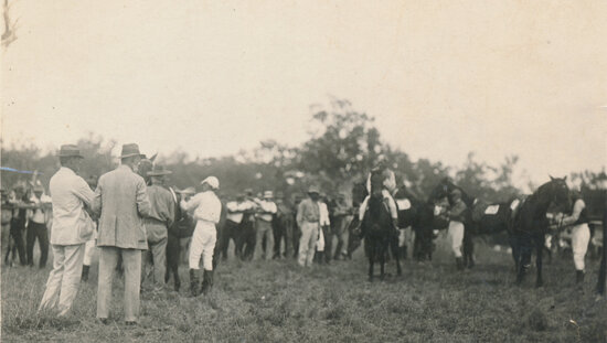 Jockeys in mounting area before horse-race at Fletcher Vale