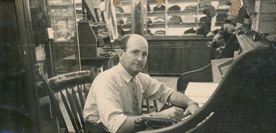 Stan Pollard at Writing Desk in his store