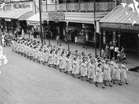School Girls marching in ANZAC Day parade, Gill Street, 1956