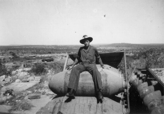 RAAF Replenishment Centre With Man Sitting on Rack of Bombs, Towers Hill
