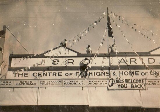 J &amp; R Arida Store sign