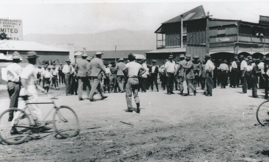 Crowd of men in an unknown street