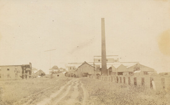 Large chimney with buildings