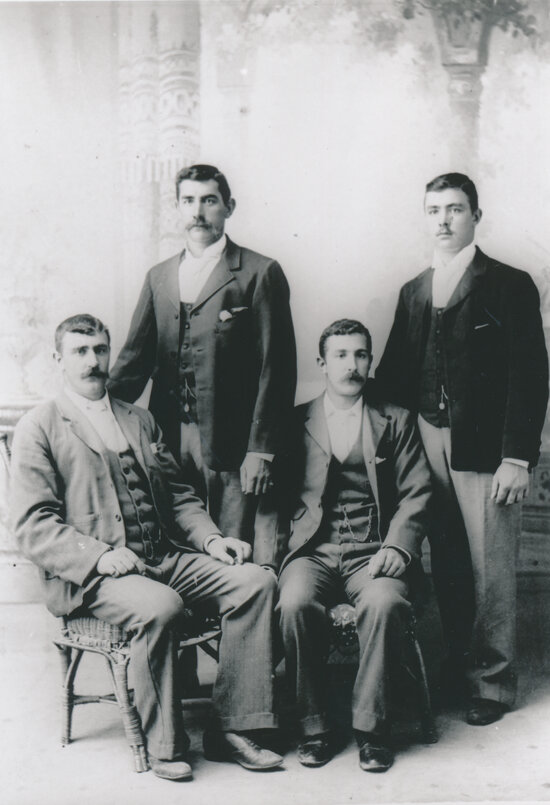 Four men studio portrait