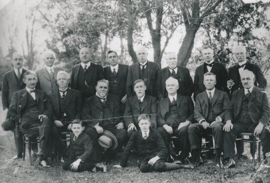 Group of men and two boys