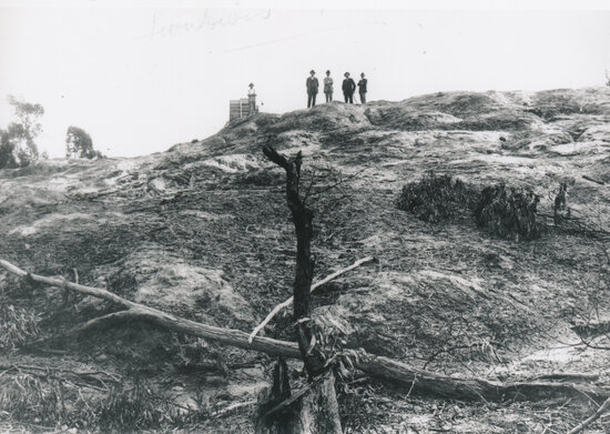 Five men on rocky outcrop