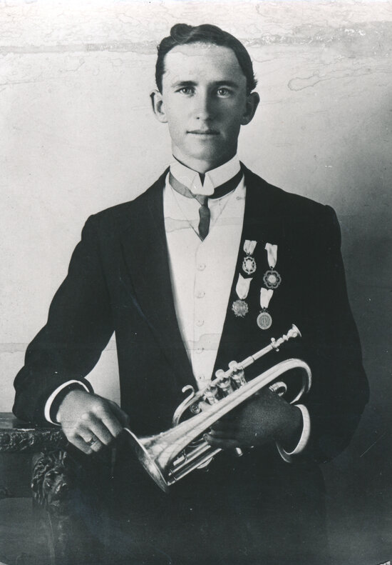Unknown man holding a cornet