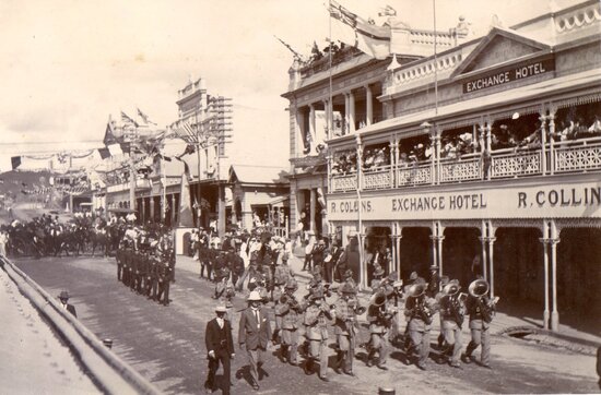 Parade turning into Mosman st from Gill st with marching band