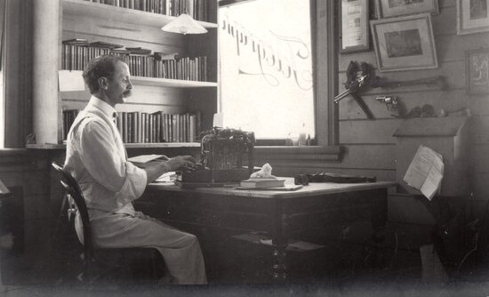 Man seated at desk in the Evening Telegraph newspaper office, Bow st