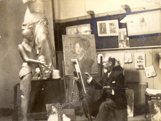 A man painting in an art studio