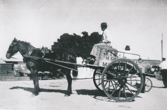 Harold Siemon in delivery cart