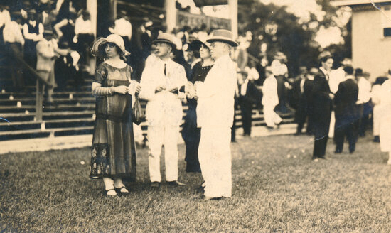 Spectators including J "Bluey" Ward, at the Racecourse