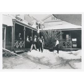 E D Miles & Co Mining Exchange Office, 65 Mosman Street - Men shovelling ice in courtyard after hail storm