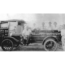 Alf Jenkin With Family Sitting on Motor Car in the Backyard of his Cordial Factory