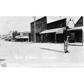 Man Standing in Gill Street, near Church Street with Olympia Theatre in background
