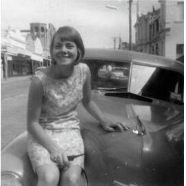 Fay Hammond sitting on car, Gill Street, 1966