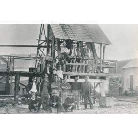 Group of Miners around a trolley platform