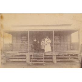 Mother and Children Standing on Front Verandah