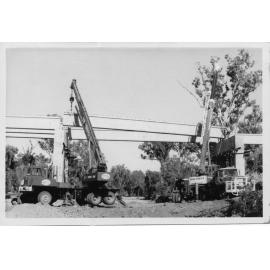 Placing girders across Big Sandy Creek, June 1972