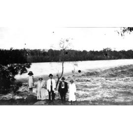 Burdekin River in Flood with Group of People on bank of the Weir
