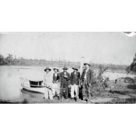 Five men at the Weir with boat