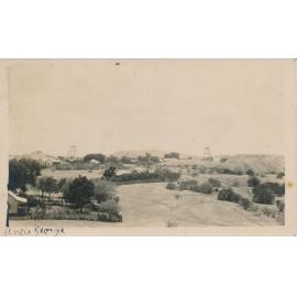 View of Charters Towers with poppet heads and Towers Hill