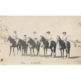 Four Stockmen including R Hurle and A Black, with an Aboriginal child Tim on horses at Pajingo Station