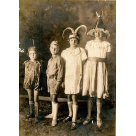 Four Children in Fancy Dress Costumes