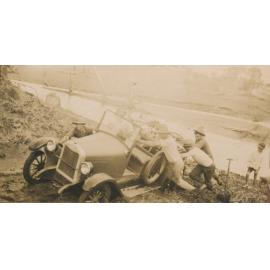 4 photos: Motor Car Being Pushed up Bank of Hann Creek, a man swimming in a dam, Swimming in the Burdekin river, Sitting on the rocks in the middle of the river