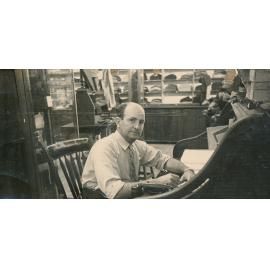 Stan Pollard at Writing Desk in his store