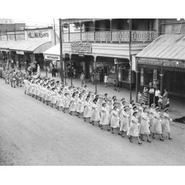 Girls College marching in Anzac Day parade, Gill Street, 1956