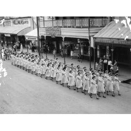 School Girls marching in ANZAC Day parade, Gill Street, 1956