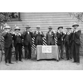 Queen Cross Reef Mine Return, Showing Eight Men Holding the Crushing Returns for May, 1903