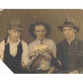 Three Men With a Gold Bar
