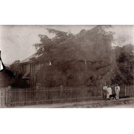 Family with Dogs outside their House, possibly 30 Towers Street