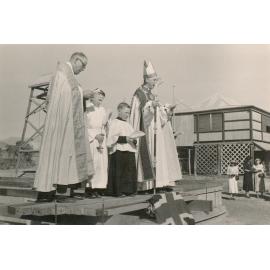 Priest Consecrating a Building