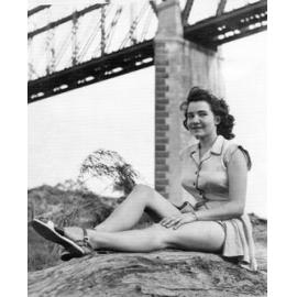 Miss Erseg, High School Sports Mistress Posing at the Burdekin Bridge, 1949